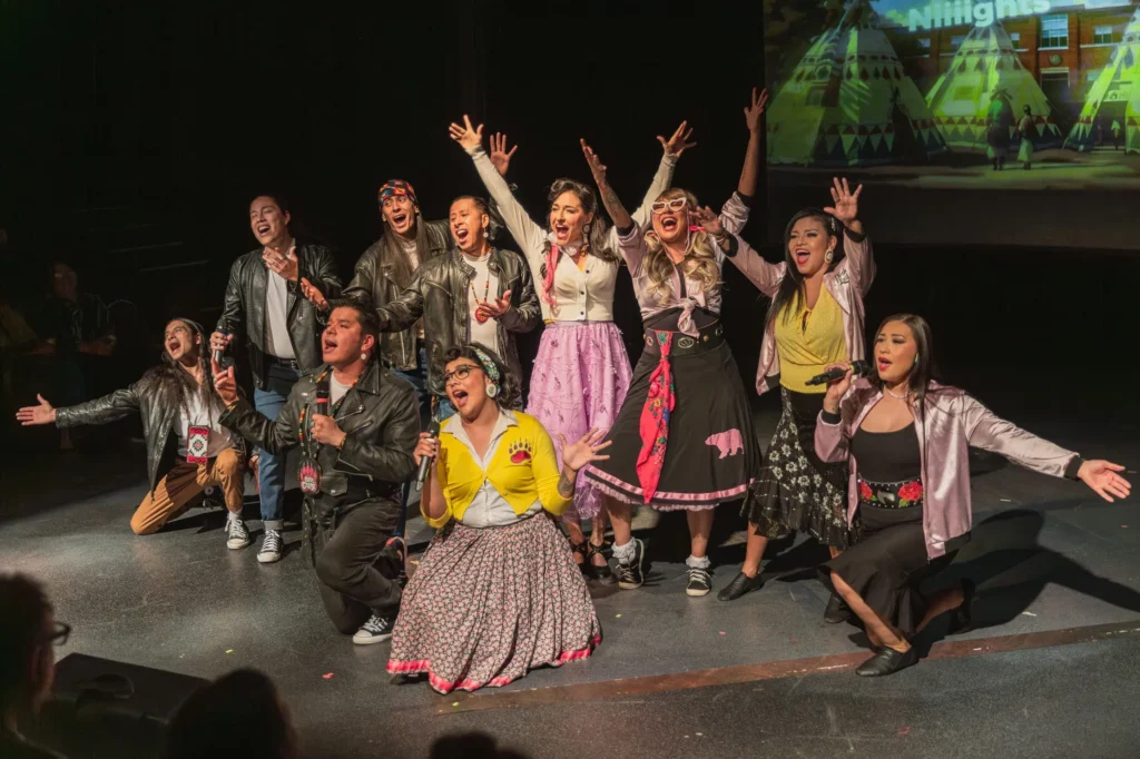 The cast of "Bear Grease" at the end of a show stopping number, posing. 