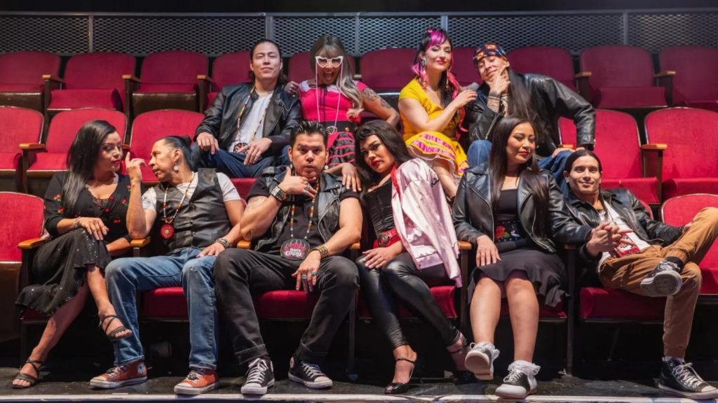 The cast of "Bear Grease" sit in audience chairs, and pose for the camera