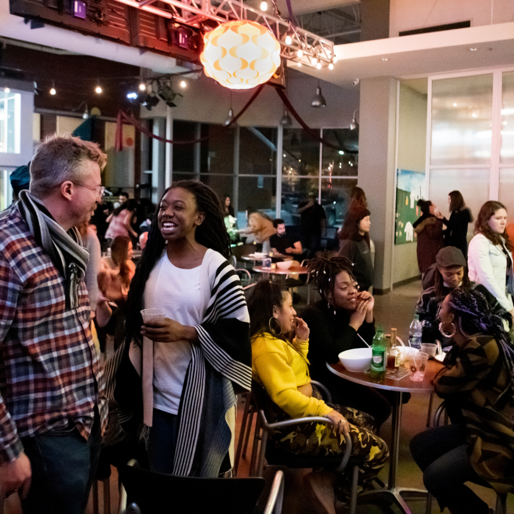 A bustling Cafe atmosphere with snacks, drinks, and merriment.