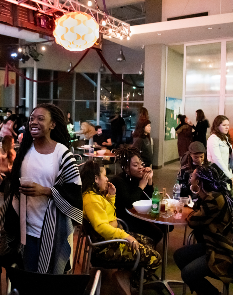 A bustling Cafe atmosphere with snacks, drinks, and merriment.